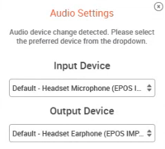 La ventana emergente dice "Cambio de dispositivo de audio detectado". Seleccione el dispositivo preferido del menú desplegable. Hay dos menús desplegables: Dispositivo de entrada y Dispositivo de salida.